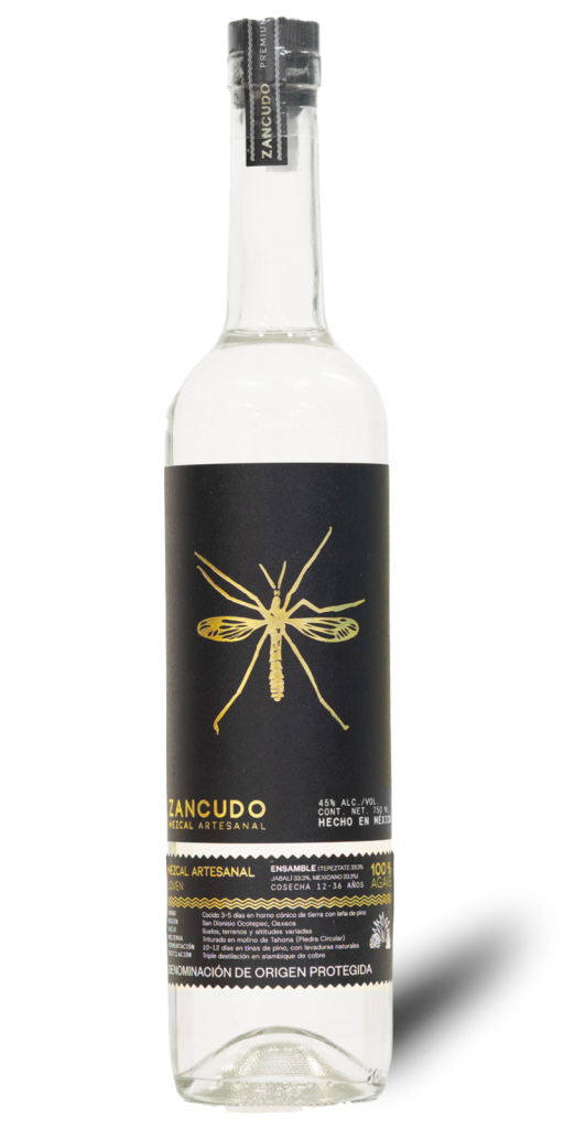 An isolated studio product shot of a clear glass bottle of Zancudo Ensamble Artisanal Mezcal against a transparent background.